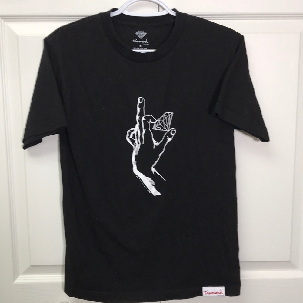 Black Diamond shirt with a hand holding a diamond